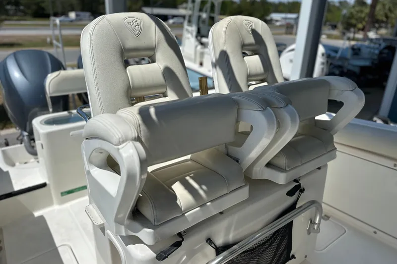 Slide: The Image of 2007 Century 2600 Center Console boat with dual white cushioned seats. - 19