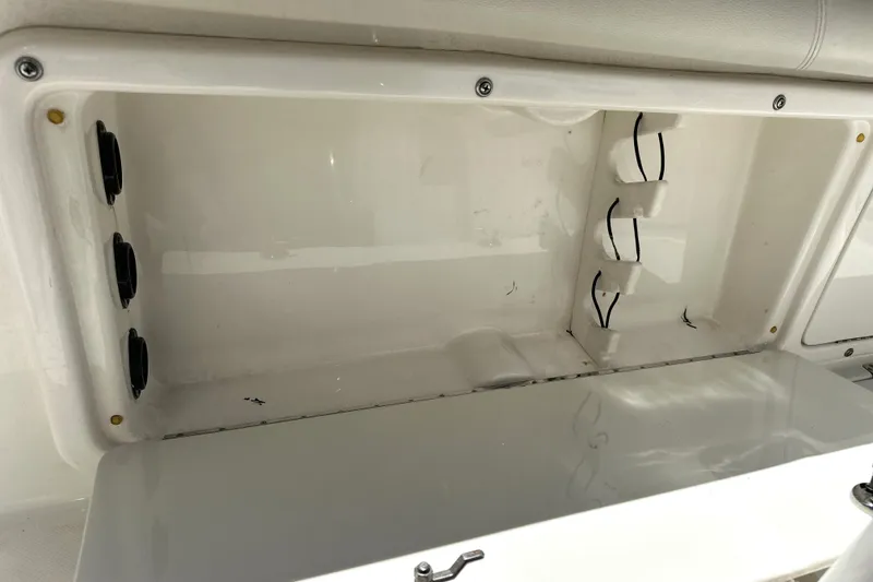 Slide: The Image of Open storage compartment in a 2007 Century 2600 Center Console boat. - 22