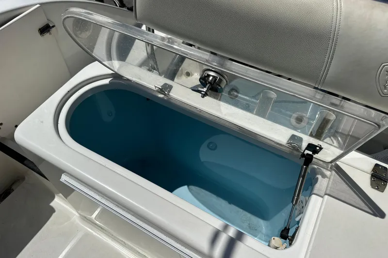 Slide: The Image of Open storage compartment on a 2007 Century 2600 Center Console boat. - 24