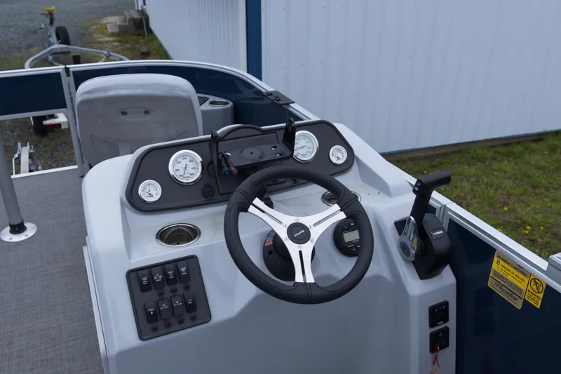 Slide: The Image of 2022 Bentley Pontoons Lil Bentley 180 Fish dashboard with steering wheel and controls. - 7