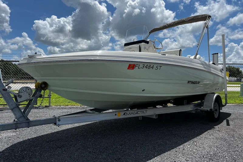 The Image of 2020 Stingray 186 CC boat on trailer under a cloudy sky. - 1