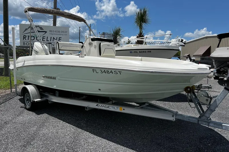Slide: The Image of 2020 Stingray 186 CC boat on trailer under clear blue sky. - 3