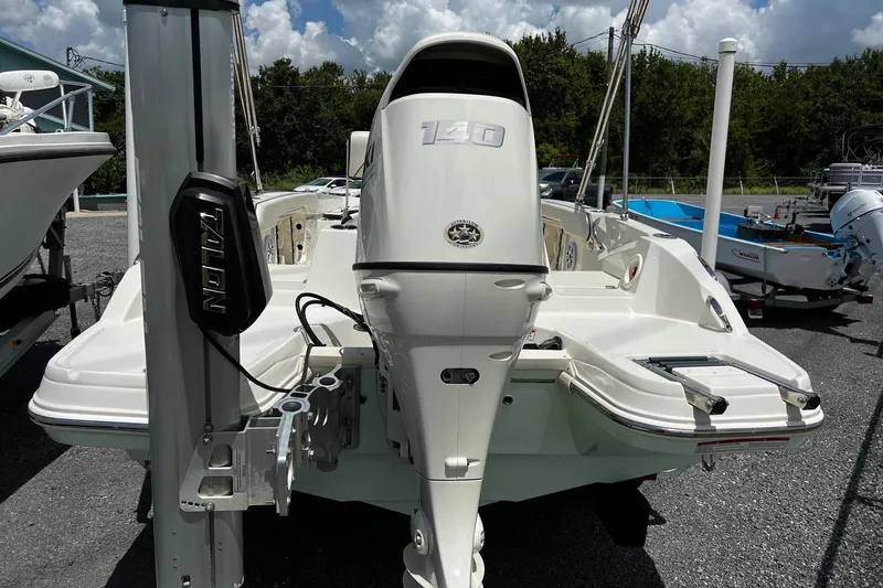 Slide: The Image of 2020 Stingray 186 CC boat with 140 HP engine, parked outdoors. - 5