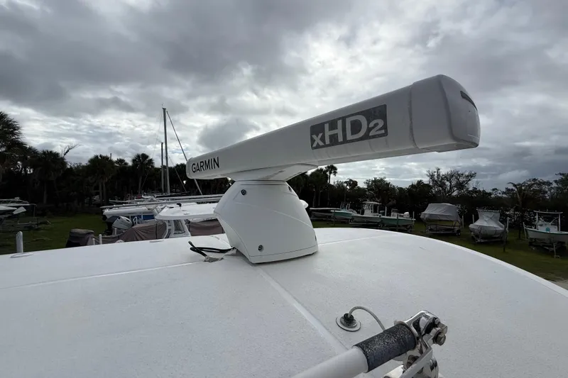Slide: The Image of Garmin xHD2 radar on 2021 Sea Hunt Ultra 255 SE boat under cloudy sky. - 28