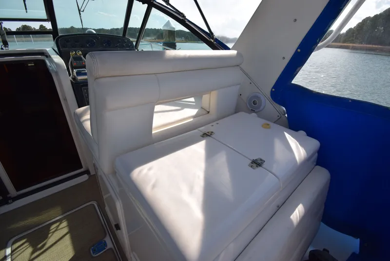 Slide: The Image of Interior of a 2001 Tiara Yachts 3500 Open with white seating area. - 11