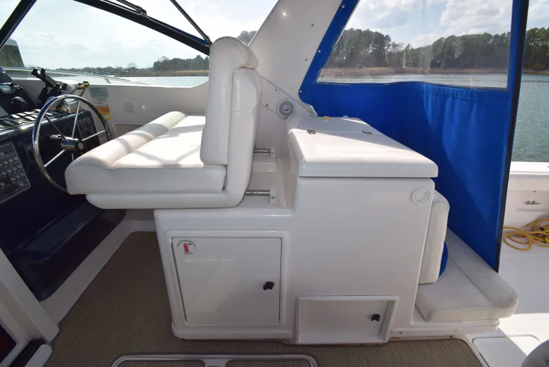 Slide: The Image of Interior of a 2001 Tiara Yachts 3500 Open with white seating area. - 12