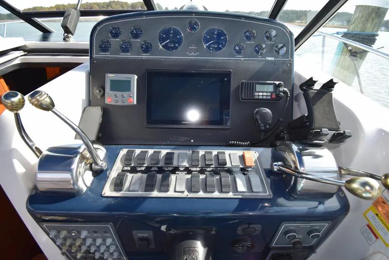 Slide: The Image of 2001 Tiara Yachts 3500 Open helm with navigation instruments. - 16