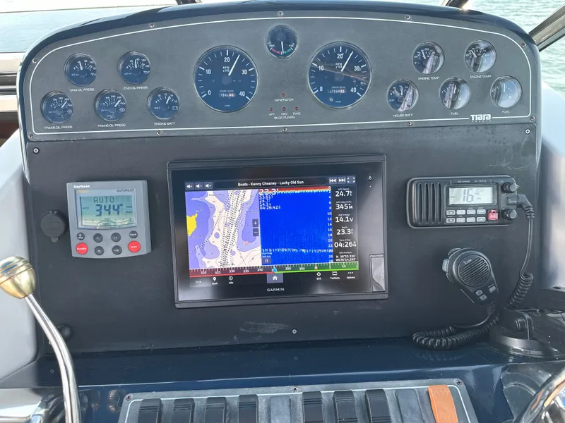 Slide: The Image of Dashboard of 2001 Tiara Yachts 3500 Open with navigation system. - 19