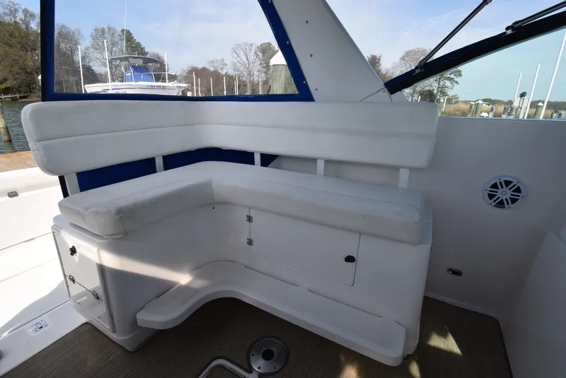 Slide: The Image of Interior of 2001 Tiara Yachts 3500 Open with white seating. - 22