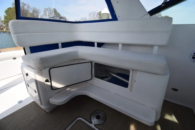 Slide: The Image of Interior of 2001 Tiara Yachts 3500 Open with white seating area. - 23