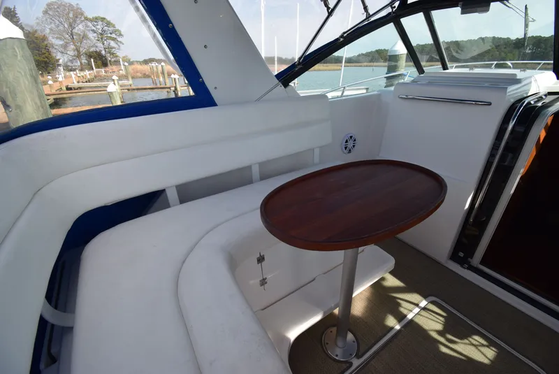 Slide: The Image of Interior of 2001 Tiara Yachts 3500 Open with wooden table. - 24