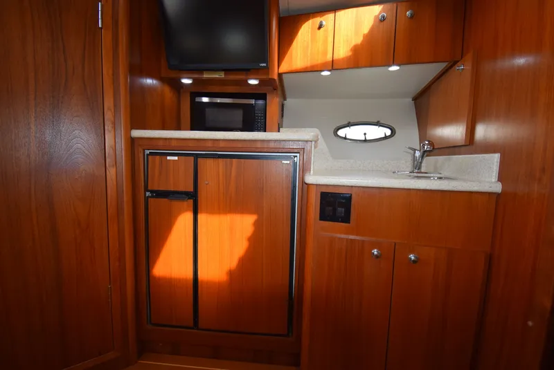 Slide: The Image of Interior of 2001 Tiara Yachts 3500 Open with wood finish. - 38