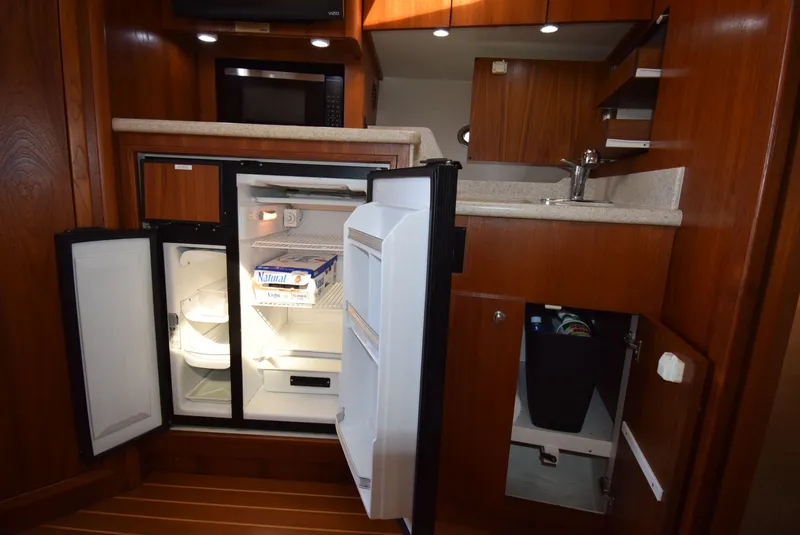Slide: The Image of Tiara Yachts 3500 Open 2001 kitchen area with open refrigerator. - 39