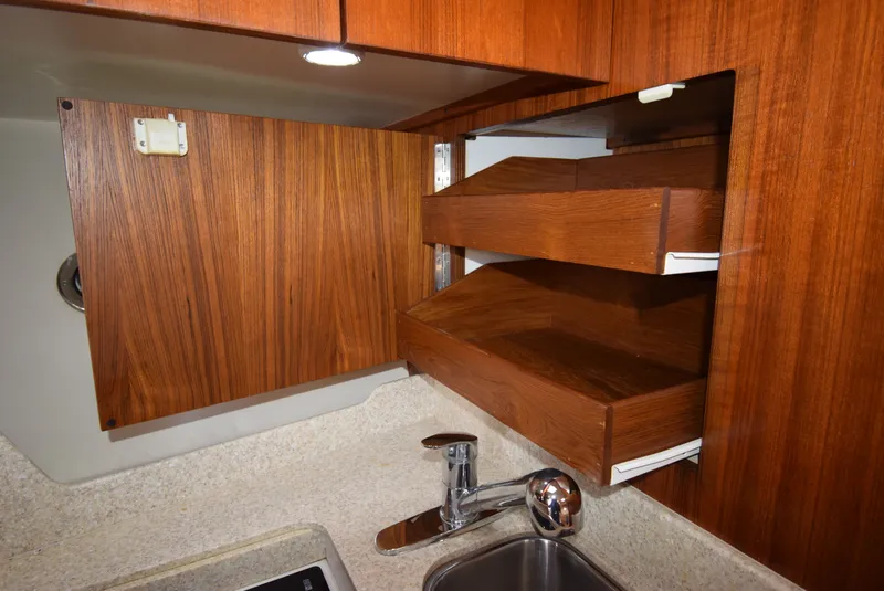 Slide: The Image of Kitchen cabinet with drawers in a 2001 Tiara Yachts 3500 Open. - 41
