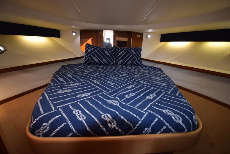 Slide: The Image of Interior of 2001 Tiara Yachts 3500 Open with cozy bed. - 42