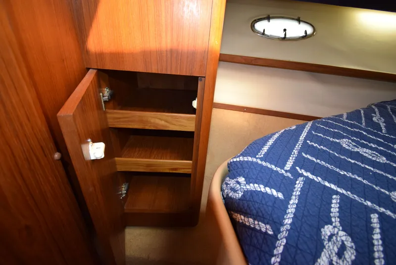 Slide: The Image of Interior of 2001 Tiara Yachts 3500 Open with cabinet and bed. - 43