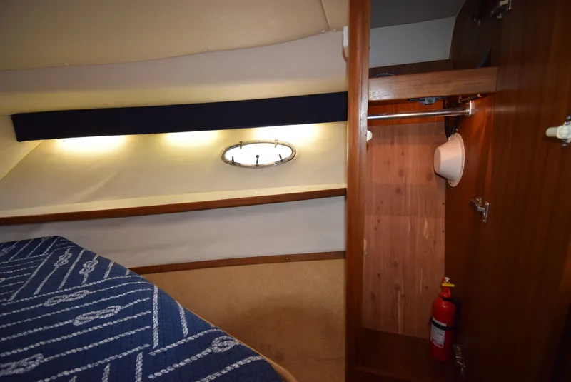 Slide: The Image of Interior of 2001 Tiara Yachts 3500 Open with closet and lighting. - 44