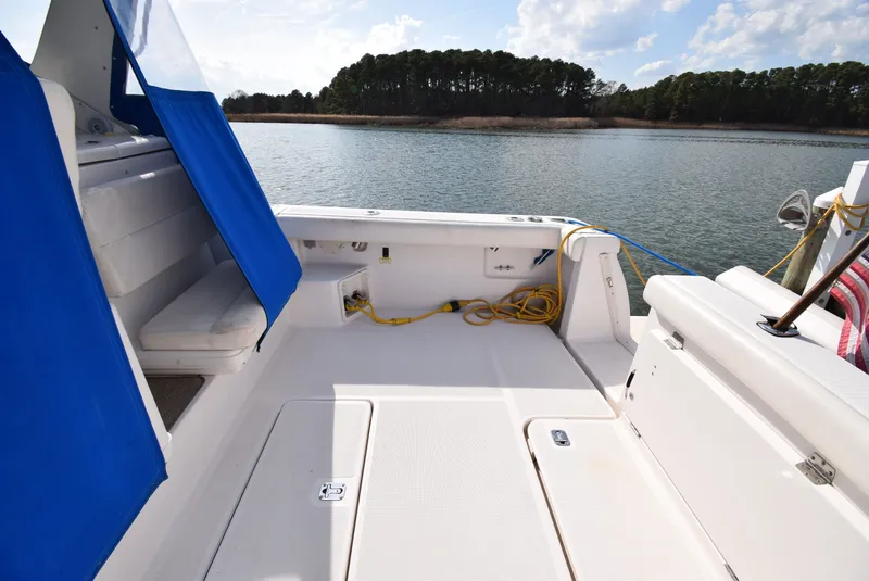 Slide: The Image of 2001 Tiara Yachts 3500 Open, spacious deck with blue covers. - 46