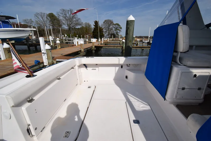 Slide: The Image of 2001 Tiara Yachts 3500 Open at dock with blue canopy. - 47