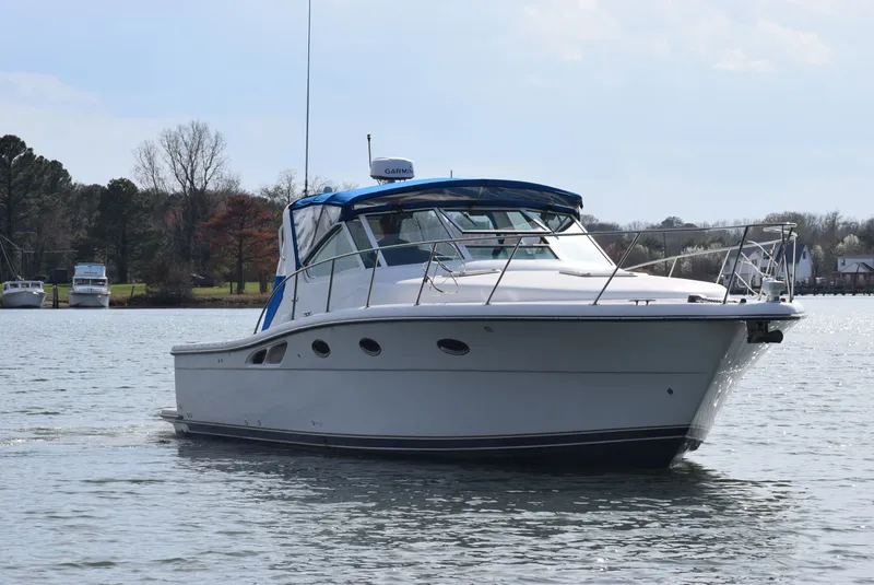 Slide: The Image of 2001 Tiara Yachts 3500 Open on calm water. - 5