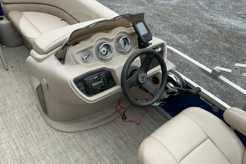 Slide: The Image of 2018 Avalon GS Cruise II boat dashboard with steering wheel and gauges. - 6