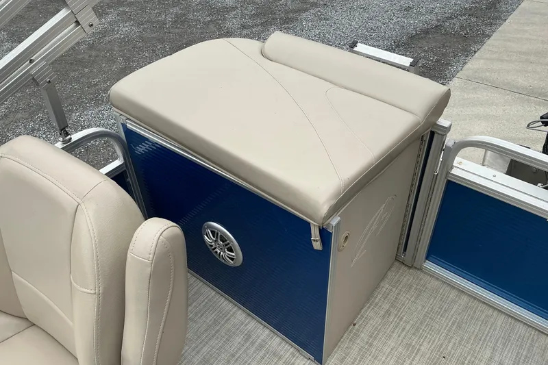 Slide: The Image of 2018 Avalon GS Cruise II boat seating area with beige upholstery and blue panel. - 8