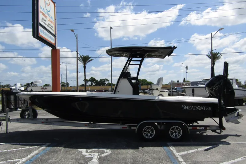 The Image of 2023 ShearWater 260 Carolina Flare boat on trailer at dealership. - 0