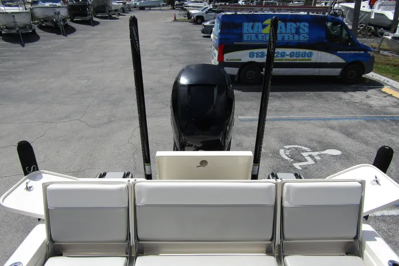 Slide: The Image of 2023 ShearWater 260 Carolina Flare boat rear view in parking lot. - 14