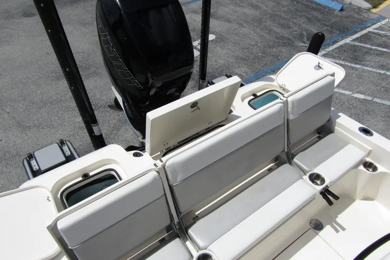 Slide: The Image of 2023 ShearWater 260 Carolina Flare boat interior with seating and storage compartments. - 15