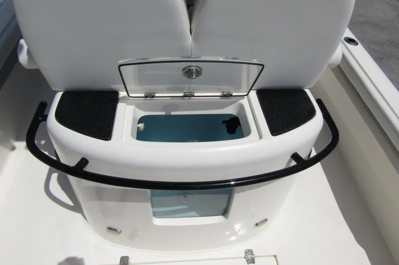 Slide: The Image of 2023 ShearWater 260 Carolina Flare boat interior with storage compartment and seating. - 19