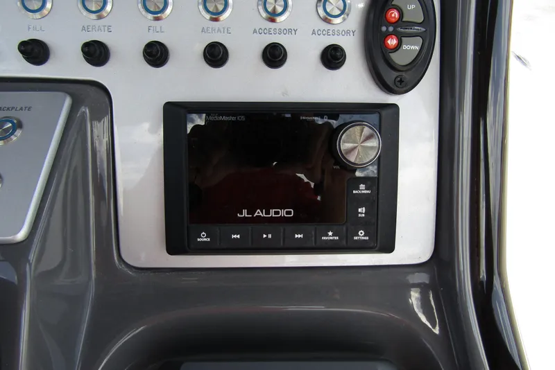Slide: The Image of Control panel of 2023 ShearWater 260 Carolina Flare with JL Audio system. - 25