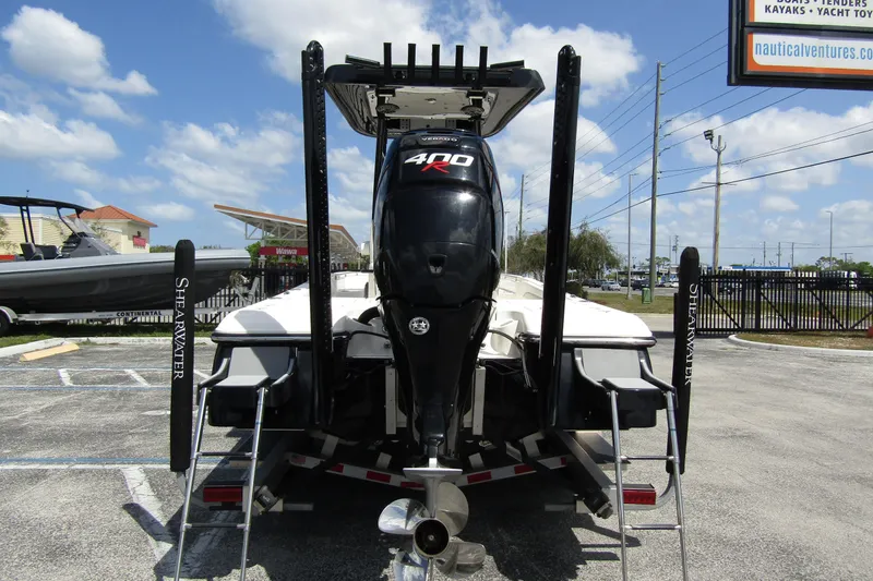 Slide: The Image of 2023 ShearWater 260 Carolina Flare boat with powerful 400 HP engine, parked outdoors. - 3