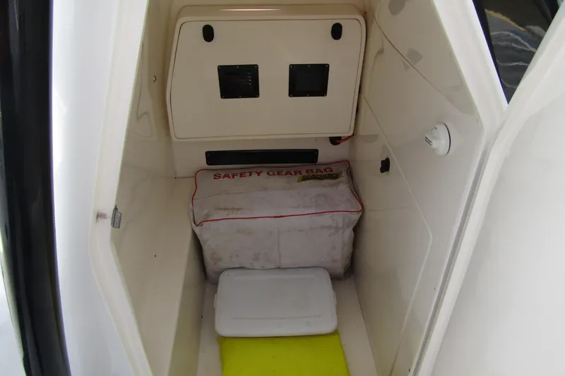 Slide: The Image of 2023 ShearWater 260 Carolina Flare boat storage area with safety gear bag. - 30
