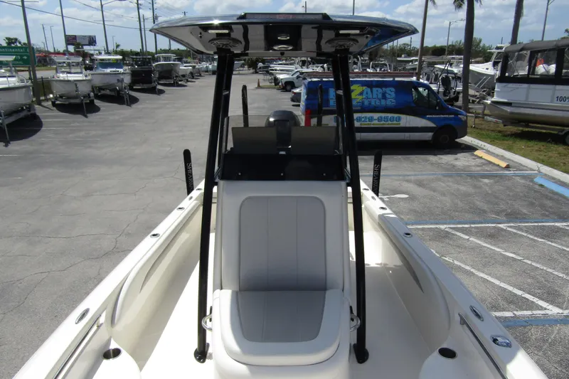 Slide: The Image of 2023 ShearWater 260 Carolina Flare boat in a dealership parking lot. - 31