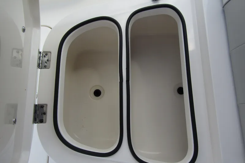 Slide: The Image of 2023 ShearWater 260 Carolina Flare boat storage compartments, open view. - 33