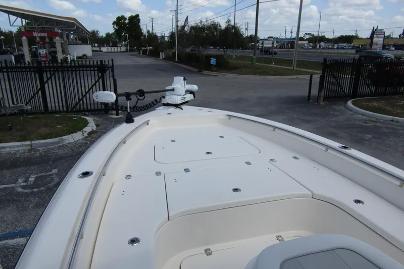 Slide: The Image of 2023 ShearWater 260 Carolina Flare boat at parking lot near gas station. - 34