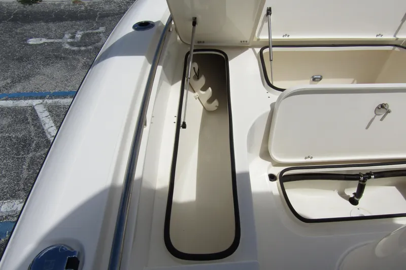 Slide: The Image of 2023 ShearWater 260 Carolina Flare boat storage compartments open on deck. - 36