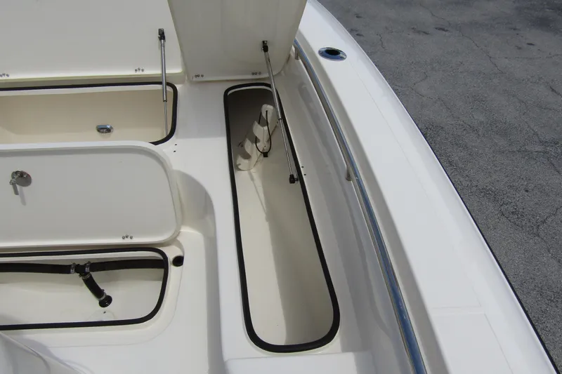 Slide: The Image of 2023 ShearWater 260 Carolina Flare boat storage compartments and rod holders. - 38