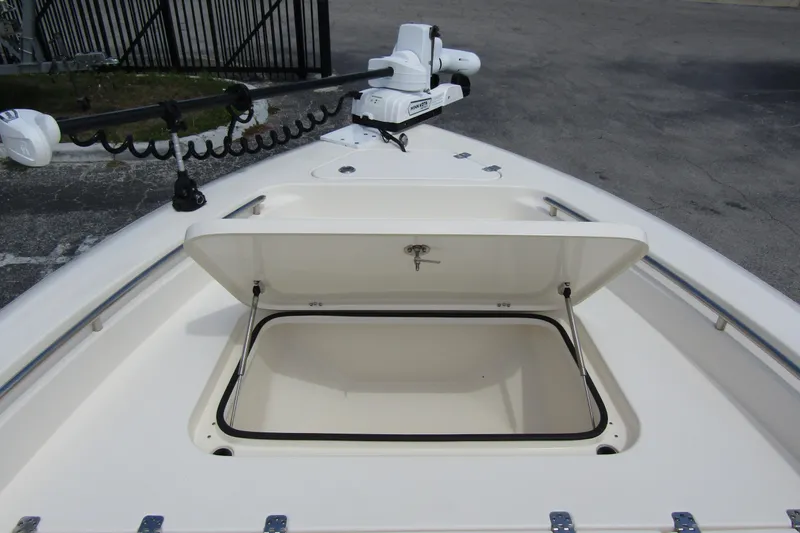 Slide: The Image of 2023 ShearWater 260 Carolina Flare boat with open storage compartment and trolling motor. - 39