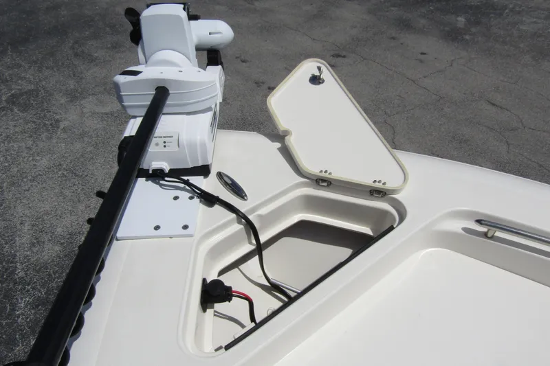 Slide: The Image of 2023 ShearWater 260 Carolina Flare boat with open storage compartment and mounted equipment. - 42