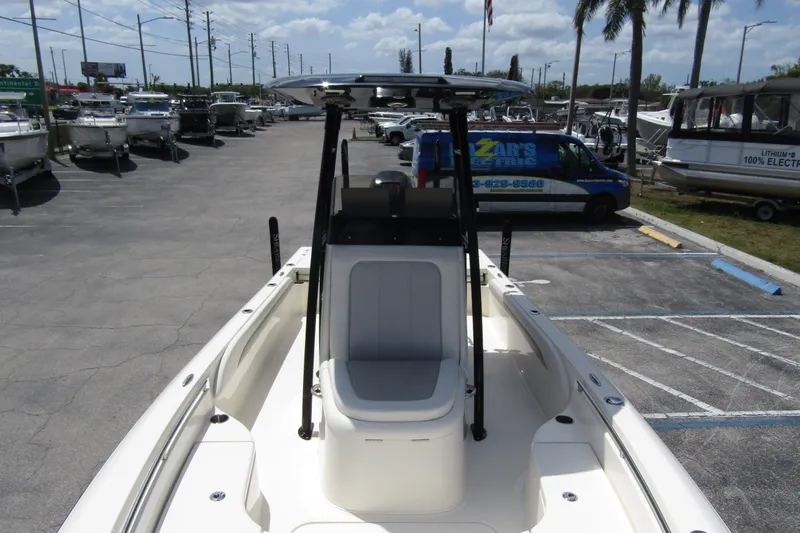 Slide: The Image of 2023 ShearWater 260 Carolina Flare boat in a dealership parking lot. - 43