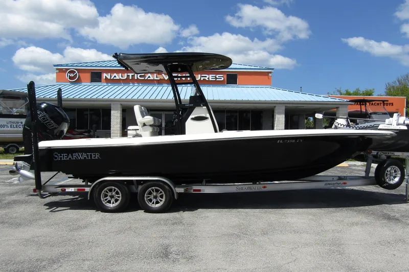 Slide: The Image of 2023 ShearWater 260 Carolina Flare boat on trailer at Nautical Ventures dealership. - 6