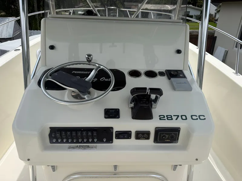 Slide: The Image of Helm console of a 1999 Pursuit 2870 Center Console boat. - 24