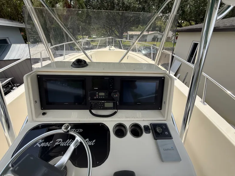 Slide: The Image of Helm of a 1999 Pursuit 2870 Center Console boat. - 26