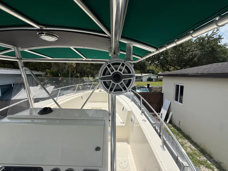 Slide: The Image of 1999 Pursuit 2870 Center Console boat with green canopy. - 35