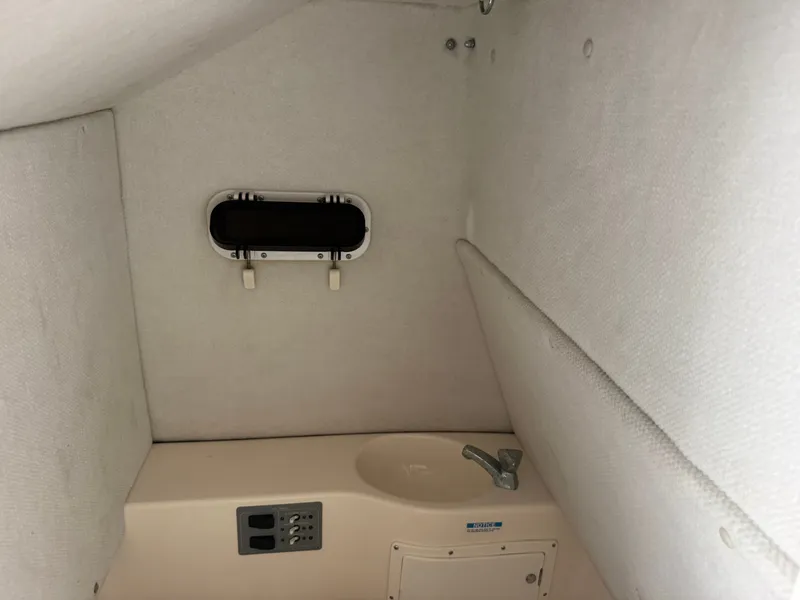 Slide: The Image of Interior of 1999 Pursuit 2870 Center Console with sink. - 47