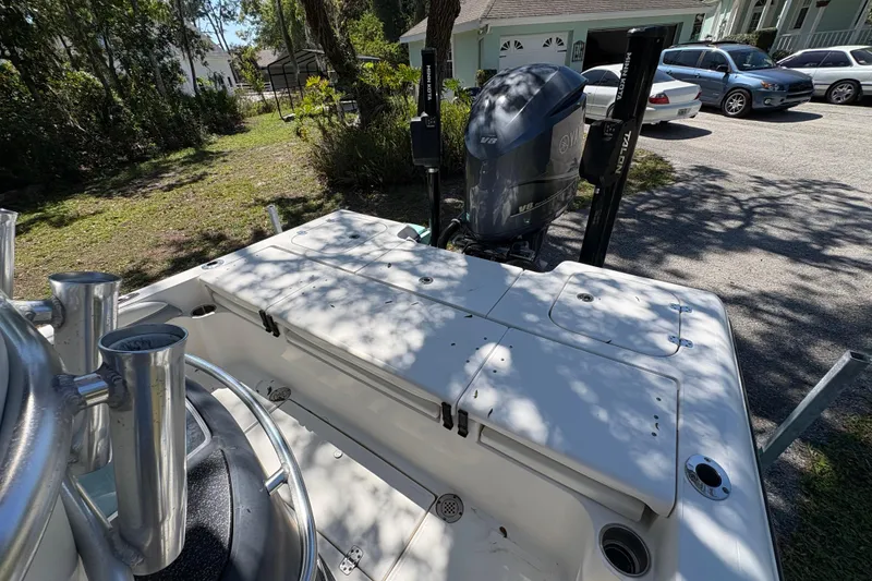 Slide: The Image of 2018 ShearWater 26 Carolina boat with Yamaha V8 engine in a driveway setting. - 15
