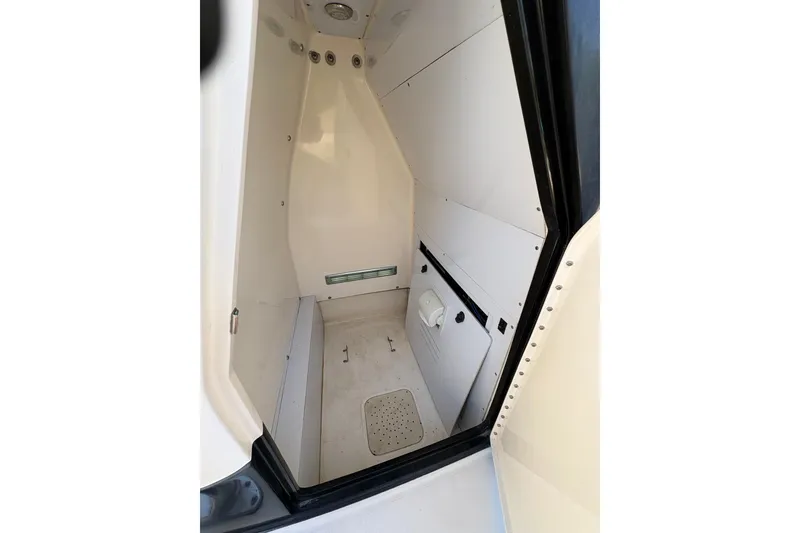 Slide: The Image of Interior cabin of 2018 ShearWater 26 Carolina boat, featuring a compact, clean design. - 16