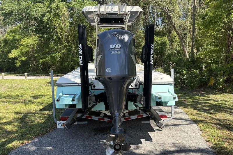 Slide: The Image of 2018 ShearWater 26 Carolina boat with Yamaha V8 350 engine, parked on a trailer. - 3