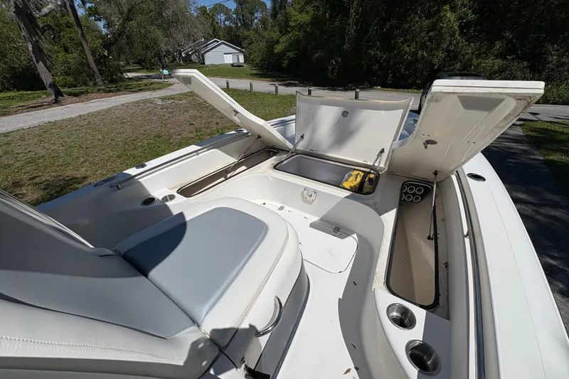 Slide: The Image of 2018 ShearWater 26 Carolina boat interior with open storage compartments. - 7